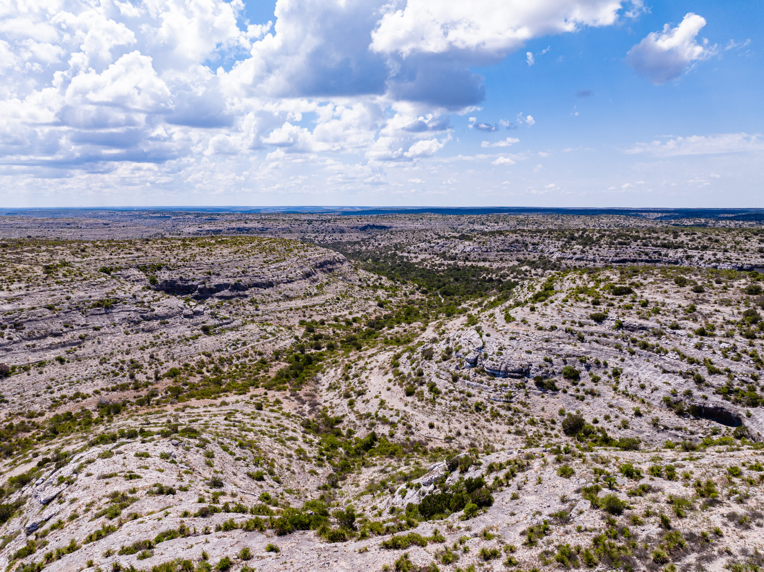 Rocky bluffs and canyons with wide-open spaces on Lane & Crane Ranch