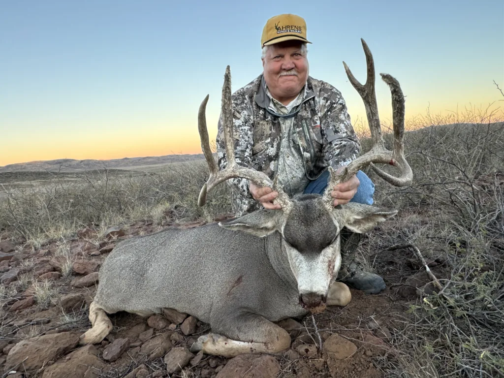 Hunter poses with his Mule Deer Harvest Ahrens Ranch and Wildlife